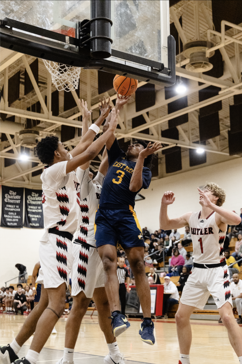 James Mcive puts up a 2 point lay-up against 3 Butler defenders after being trash talked earlier in the game. 